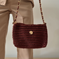 Bolso tipo cartera bordó con cadena dorada artesanal.