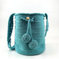 Mochila Domenechsa celeste con decoración central de piedra brillante.